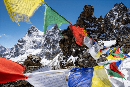 Himalayan prayer flags high up on the mountain. climbing nutrition in an important aspect to climbing at high elevation. 