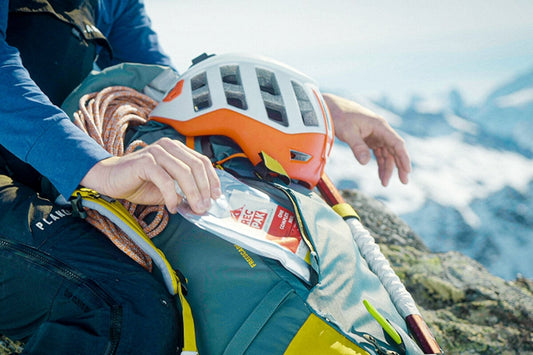 climber pulls Recpak, the best backpacking meal for the backcountry, out of their backpack