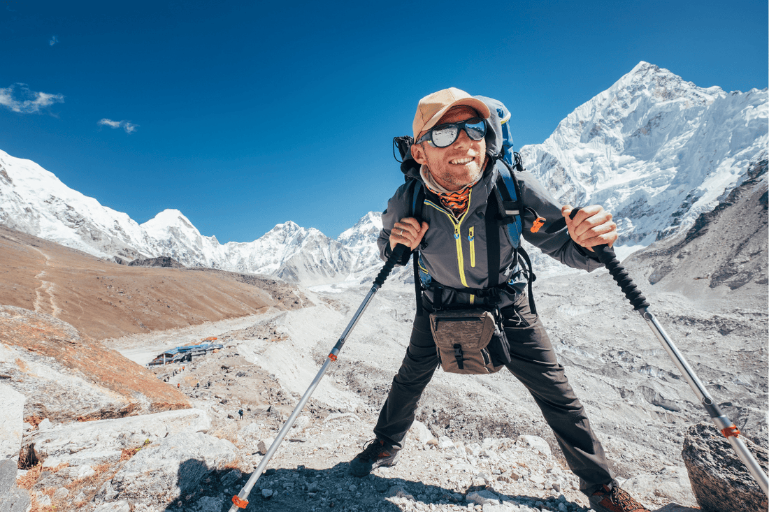 Climber using endurance fuel to summit mountain