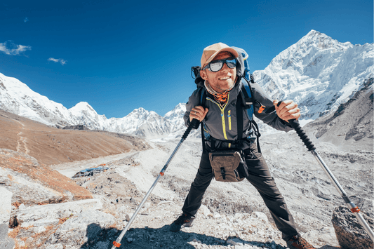 Climber using endurance fuel to summit mountain